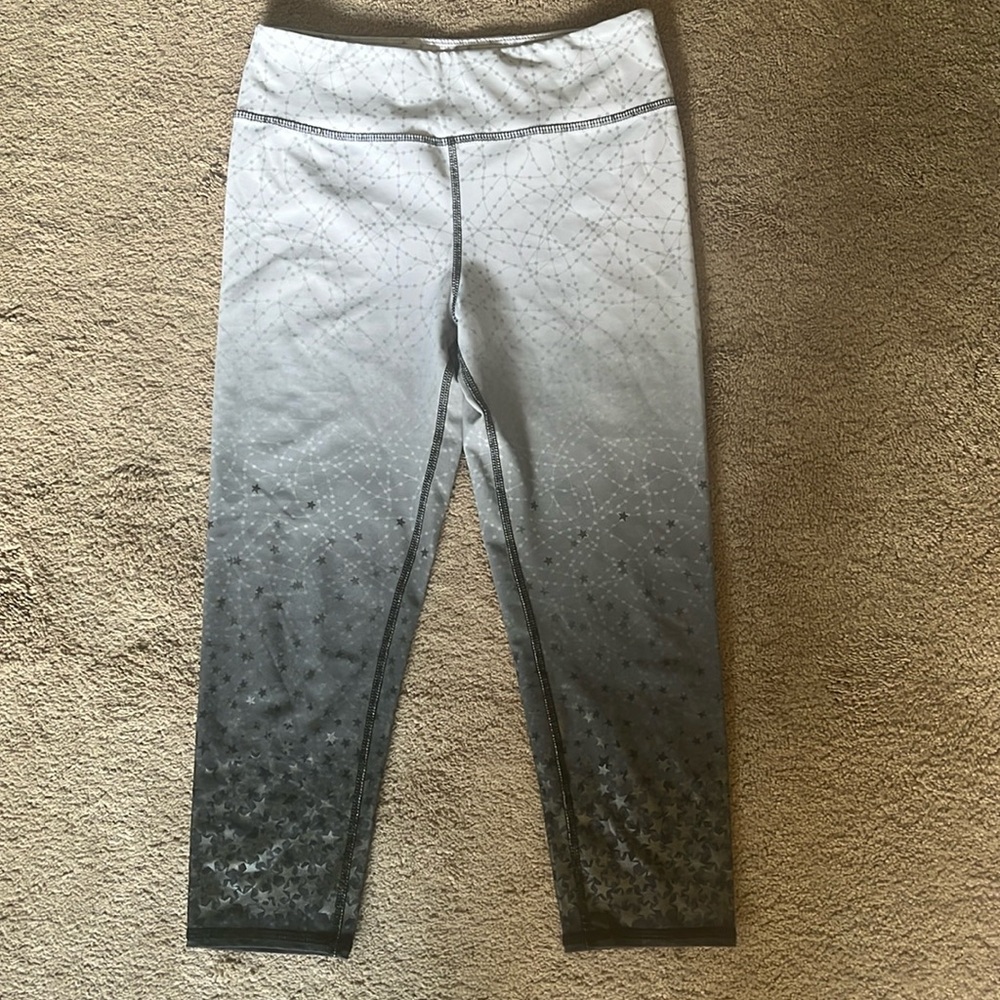 White fading to dark gray leggings with stars down legs